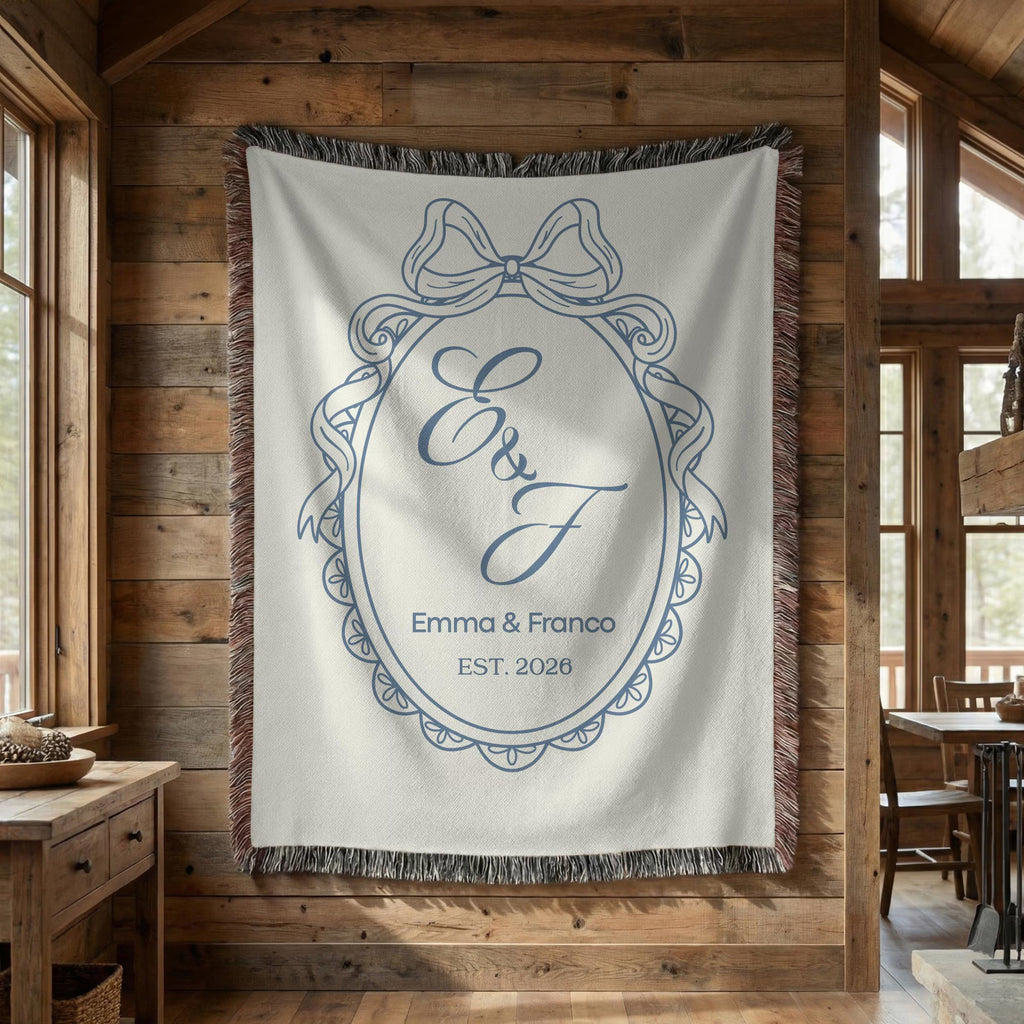 Custom blue monogram wedding blanket displayed as wall decor