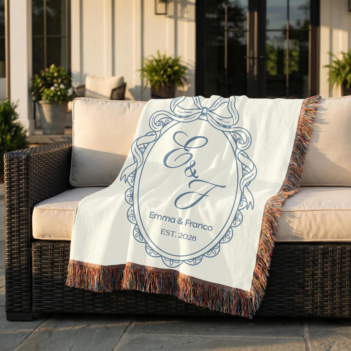 Custom blue wedding woven blanket styled on an outdoor chair