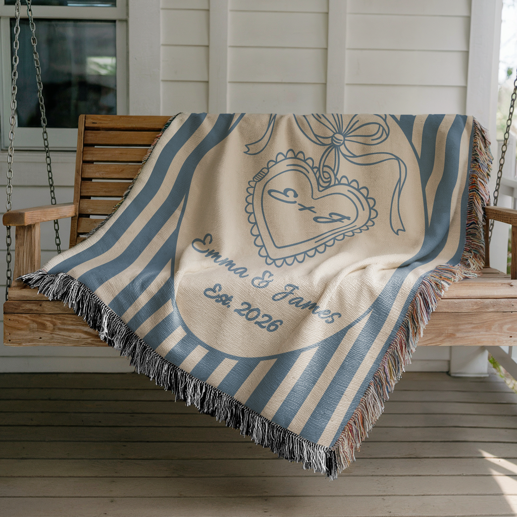 Custom couple heart monogram woven blanket with names displayed on a porch swing
