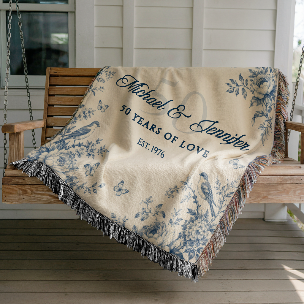 Custom golden anniversary woven blanket with couple names displayed on a porch swing