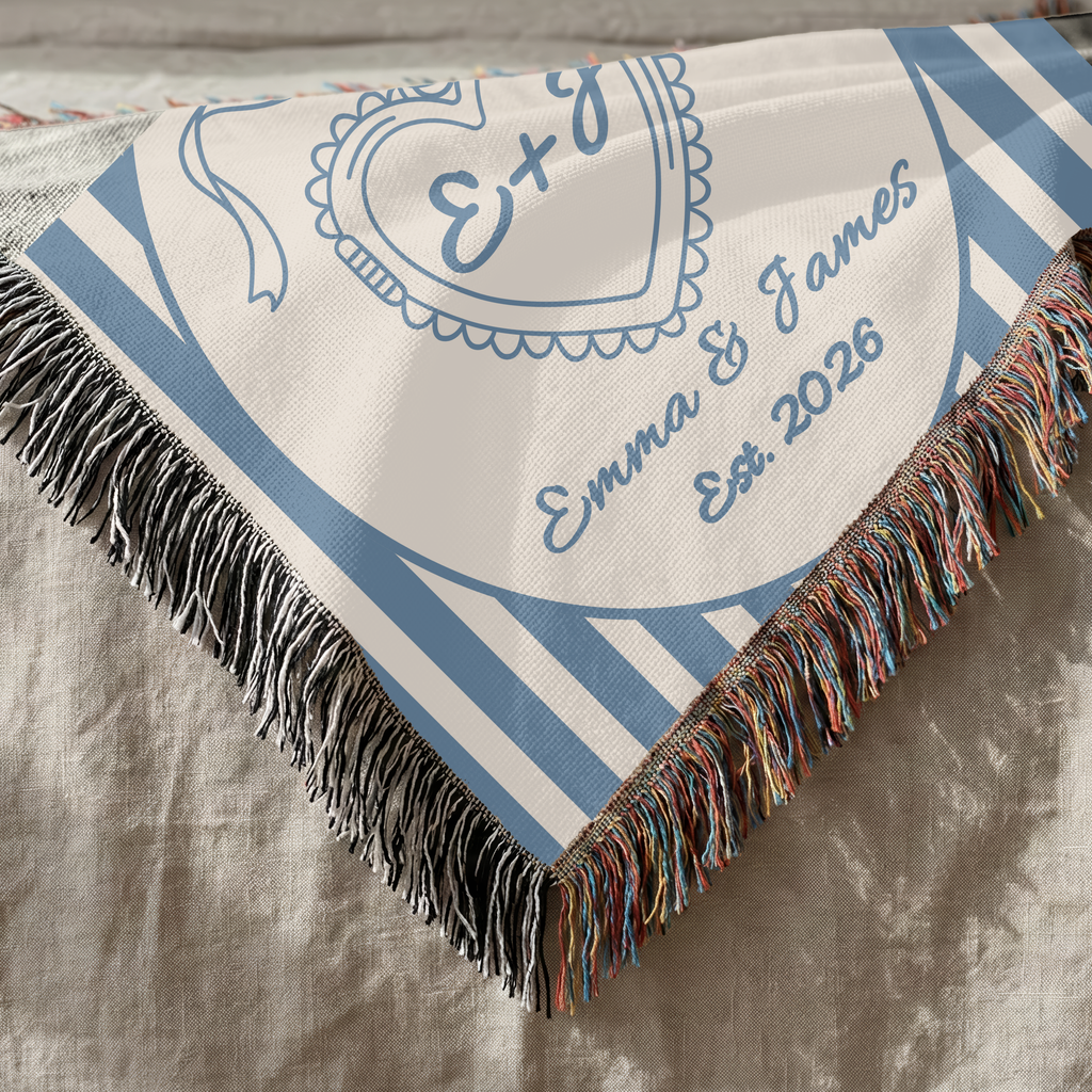 Close up of personalized heart monogram woven blanket showing texture and decorative fringe