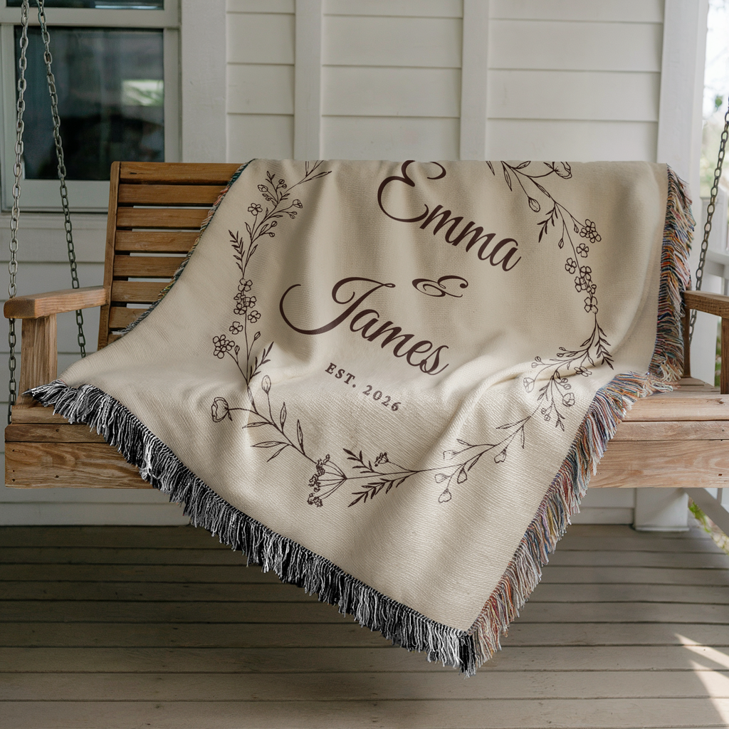 Personalized anniversary woven blanket with floral design draped over a porch swing