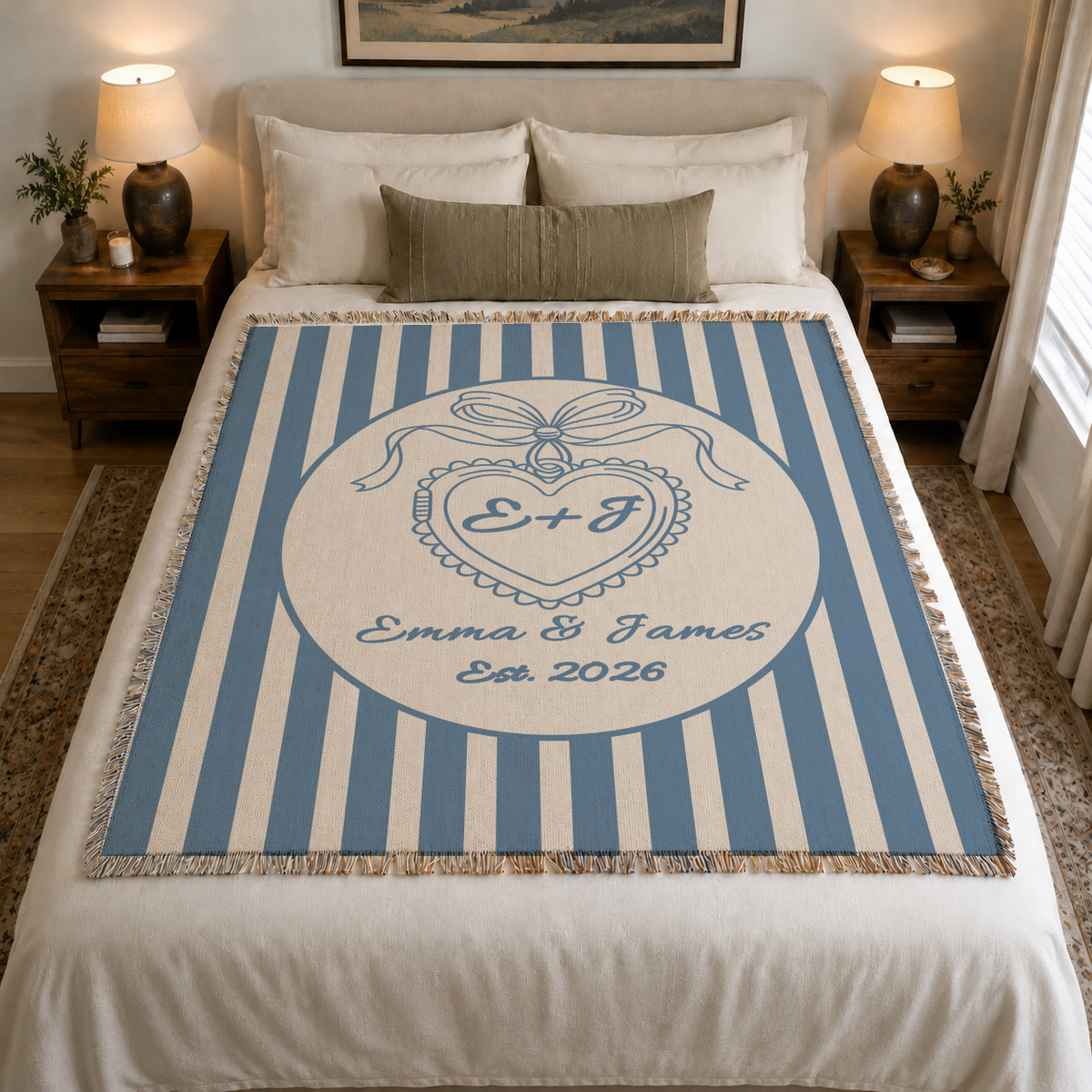 Personalized blue wedding woven blanket with heart monogram styled on a neutral bedroom bed