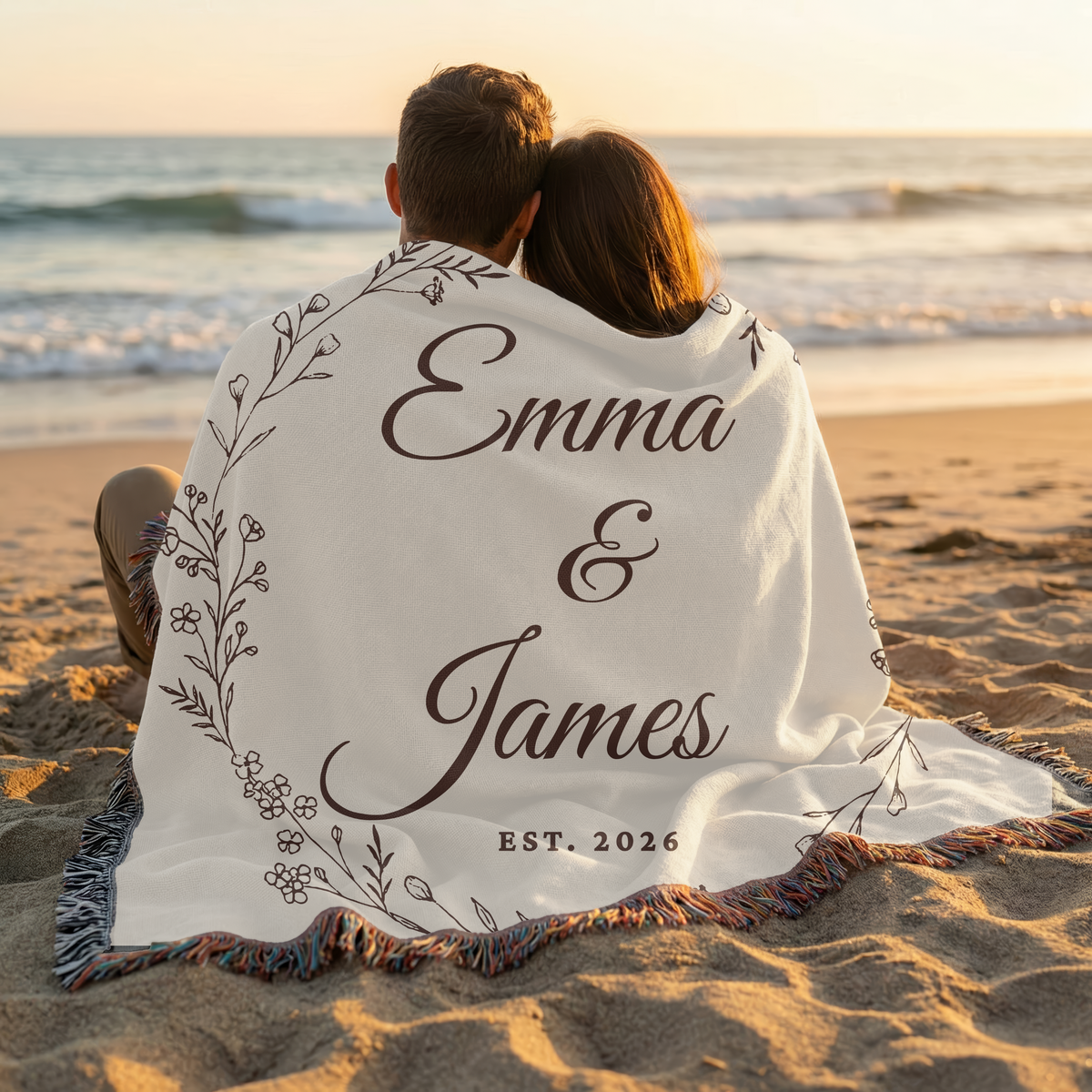Personalized couple wedding blanket with custom names used as a beach keepsake