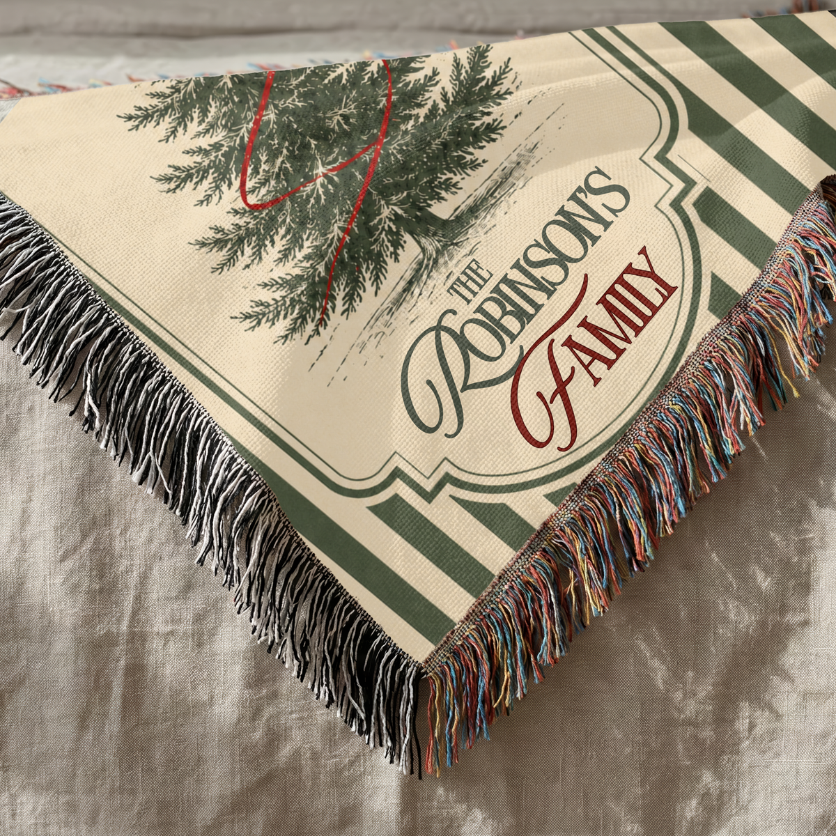 Personalized green stripe Christmas blanket showing custom family design and woven texture