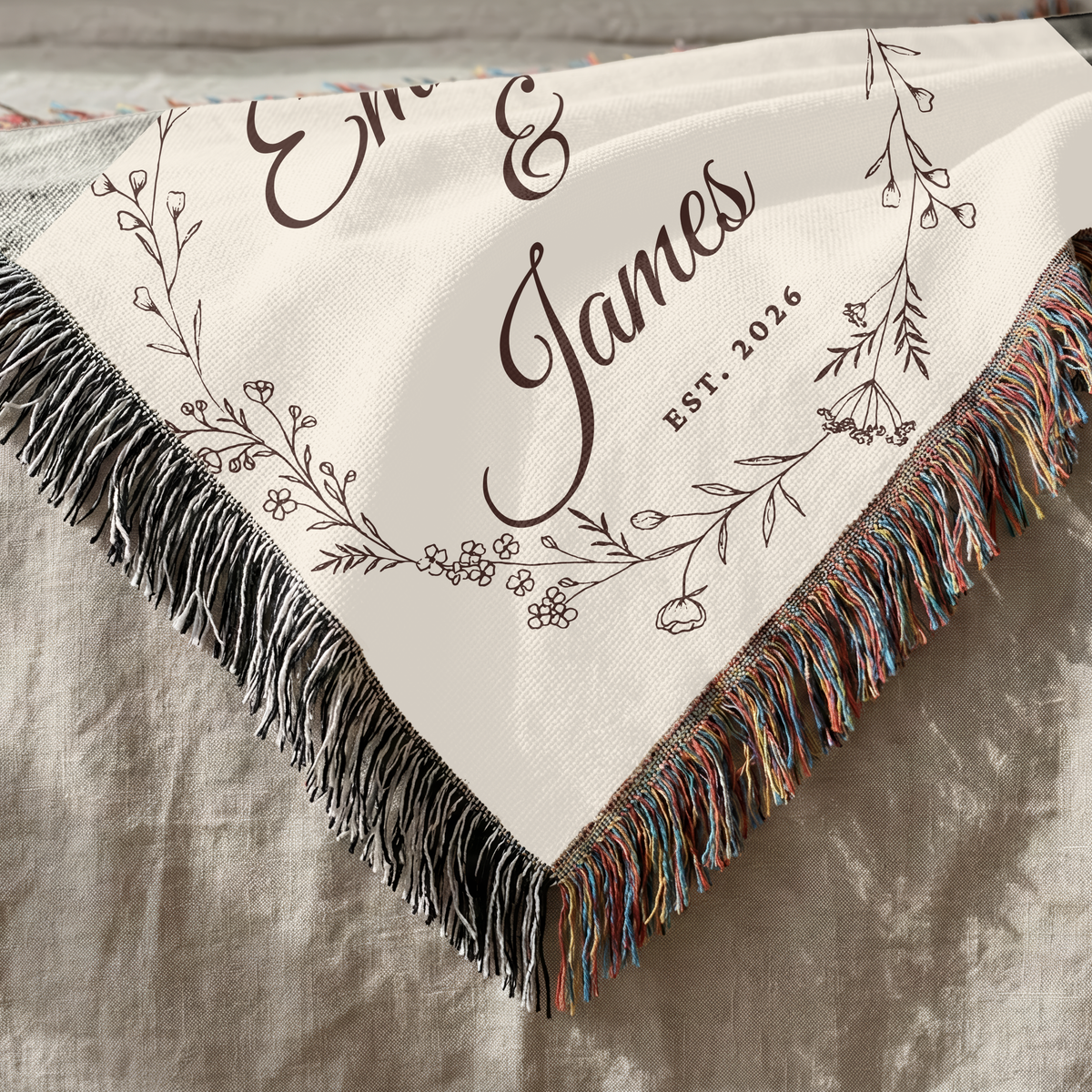 Close up of personalized wedding woven blanket showing cotton texture and decorative fringe